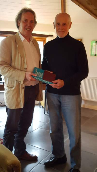 John Robinson presenting his book to Angus Ramsay